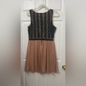 Pinkish nude tulle black dress.